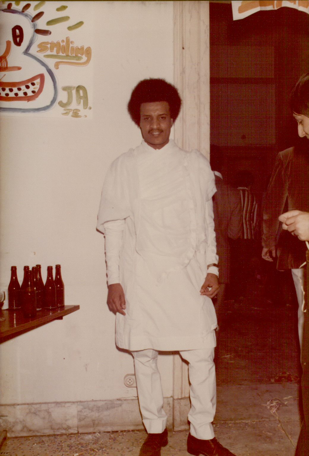 Amha in traditional Ethiopian white dress at a gathering